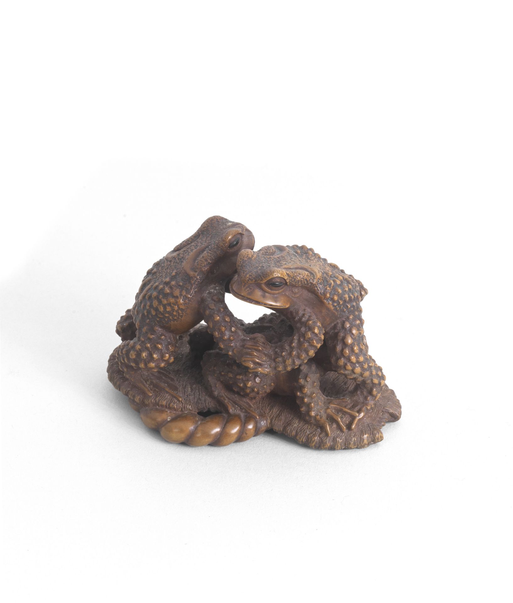 MASANAO OF ISE (ACTIVE 19TH CENTURY) A Wood Okimono (Table Ornament) of Three Toads Edo period (...