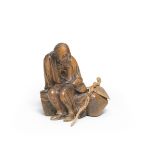 A WOOD OKIMONO (TABLE ORNAMENT) OF AN ELDERLY WOMAN Edo period (1615-1868) or Meiji era (1868-19...