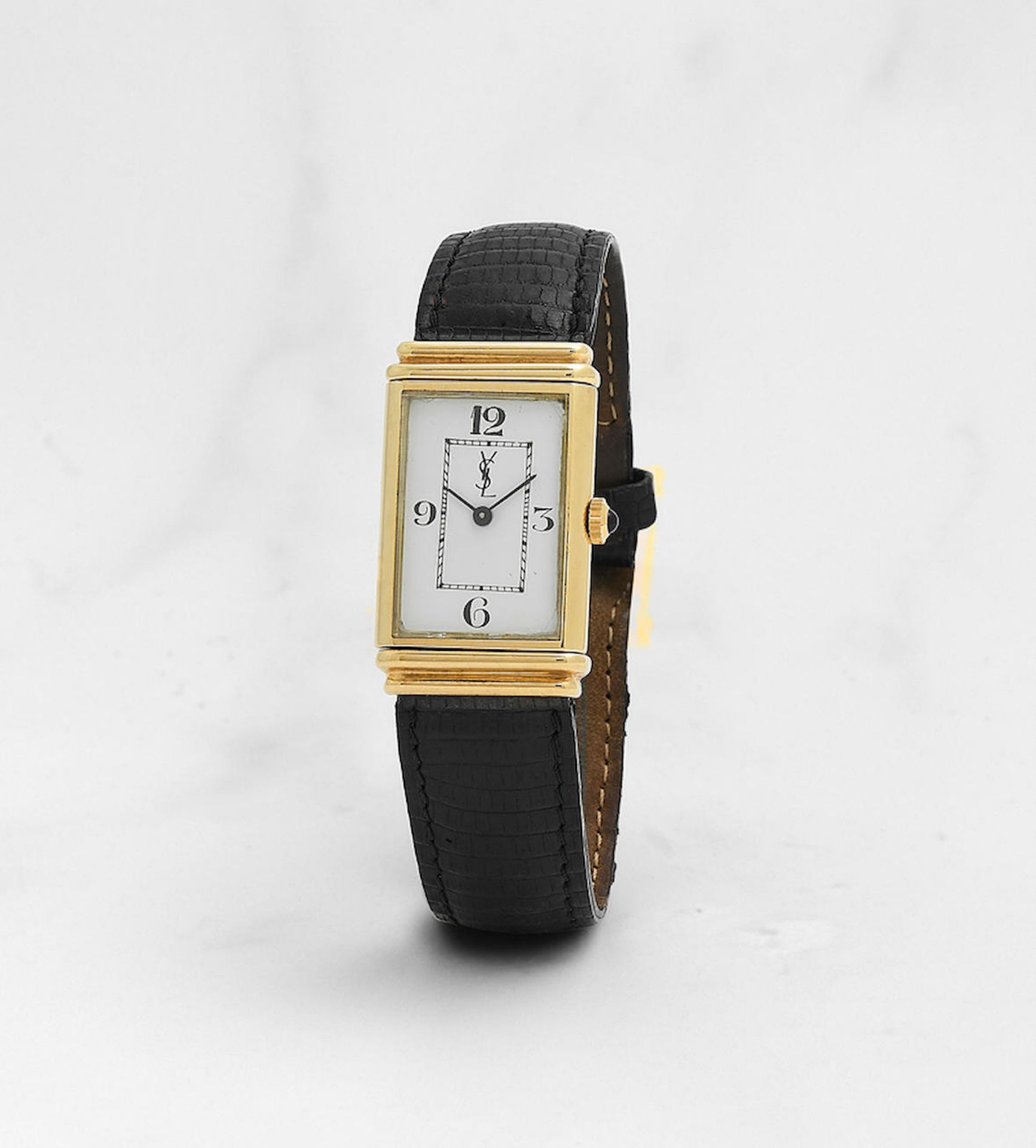 Yves Saint Laurent. Montre bracelet en or jaune 18K (750) rectangulaire r&#233;versible mouvemen...