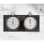 Heuer. Lot de deux chronographes stopwatch compteurs de bord en acier remontoir au pendant Heuer...