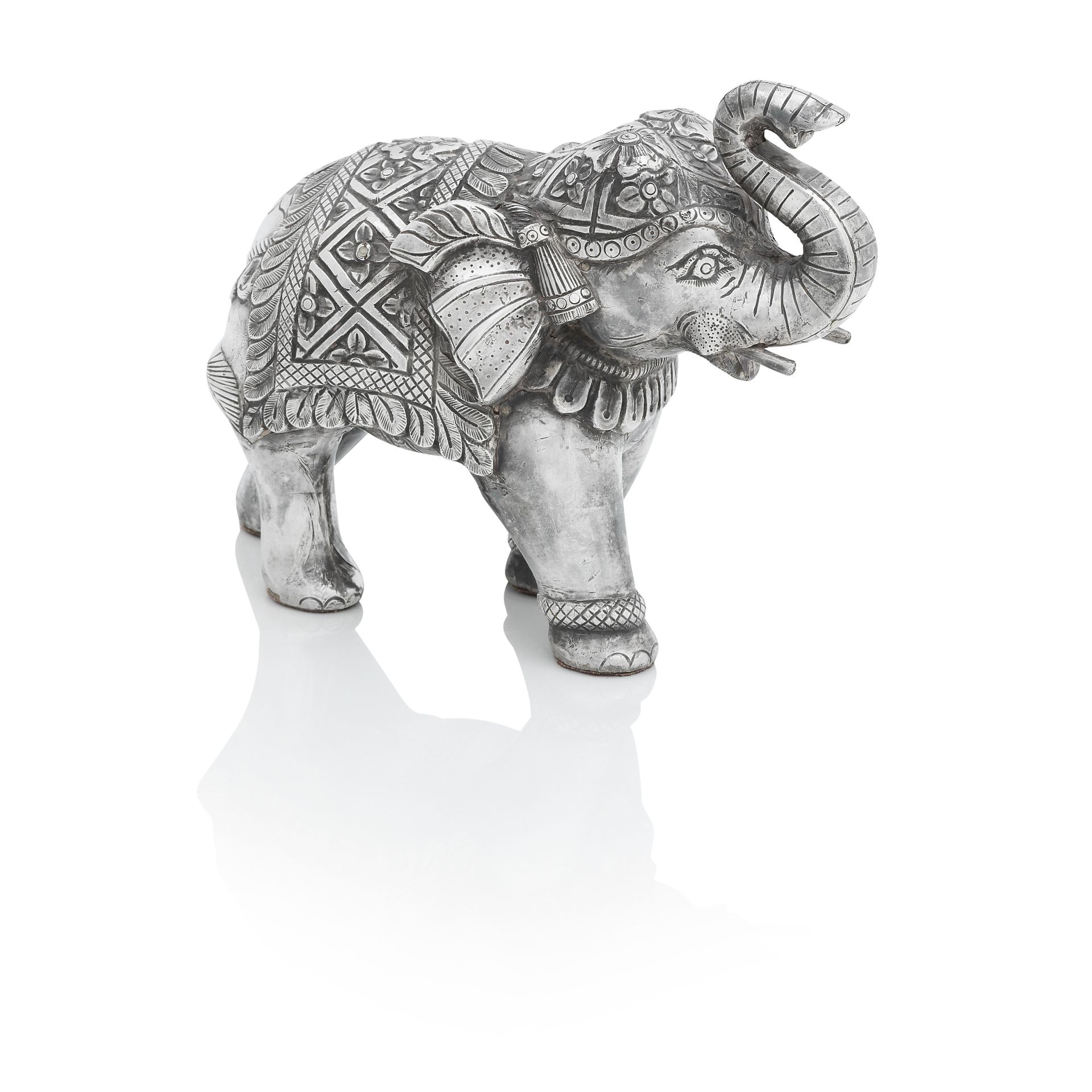 AN INDIAN SILVER-COVERED MODEL OF AN ELEPHANT 20th century