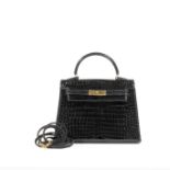 HERMES Paris, made in France, 1992. Mini 'Kelly' Sellier 15. crocodile porosus noir 15 cm