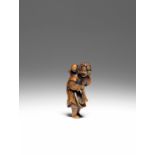 NETSUKE EN BOIS REPR&#201;SENTANT UN HOLLANDAIS AVEC UN ENFANT XVIIIe si&#232;cle