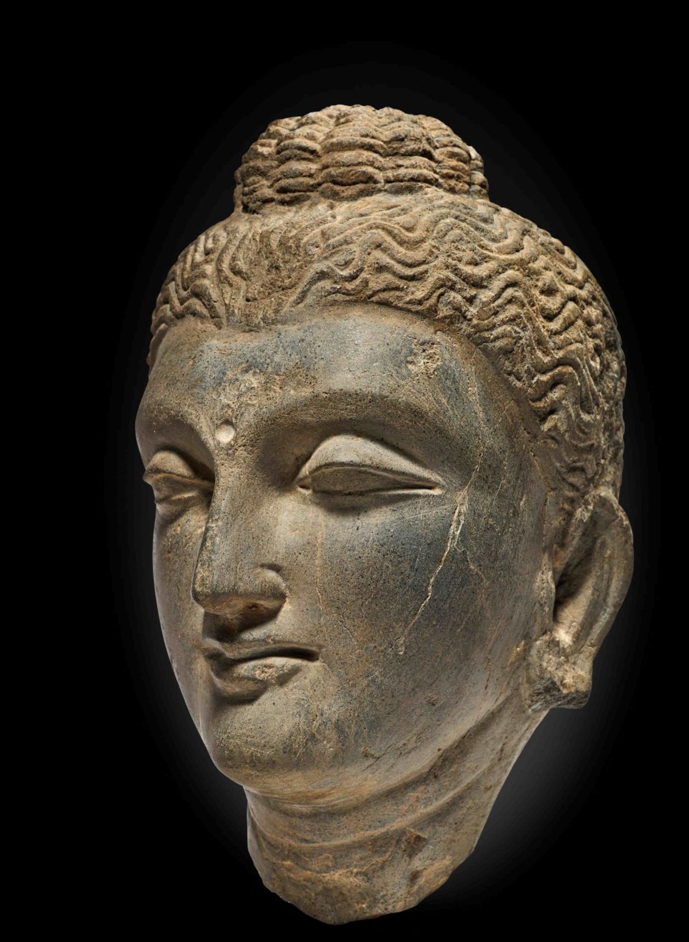 T&#202;TE DE BOUDDHA EN SCHISTE GRIS ANCIENNE R&#201;GION DU GANDHARA, IIIE/IVE SI&#200;CLE