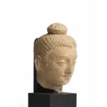 DEUX T&#202;TES DE BOUDDHA EN STUC ANCIENNE R&#201;GION DU GANDHARA, IVE/VE SI&#200;CLE