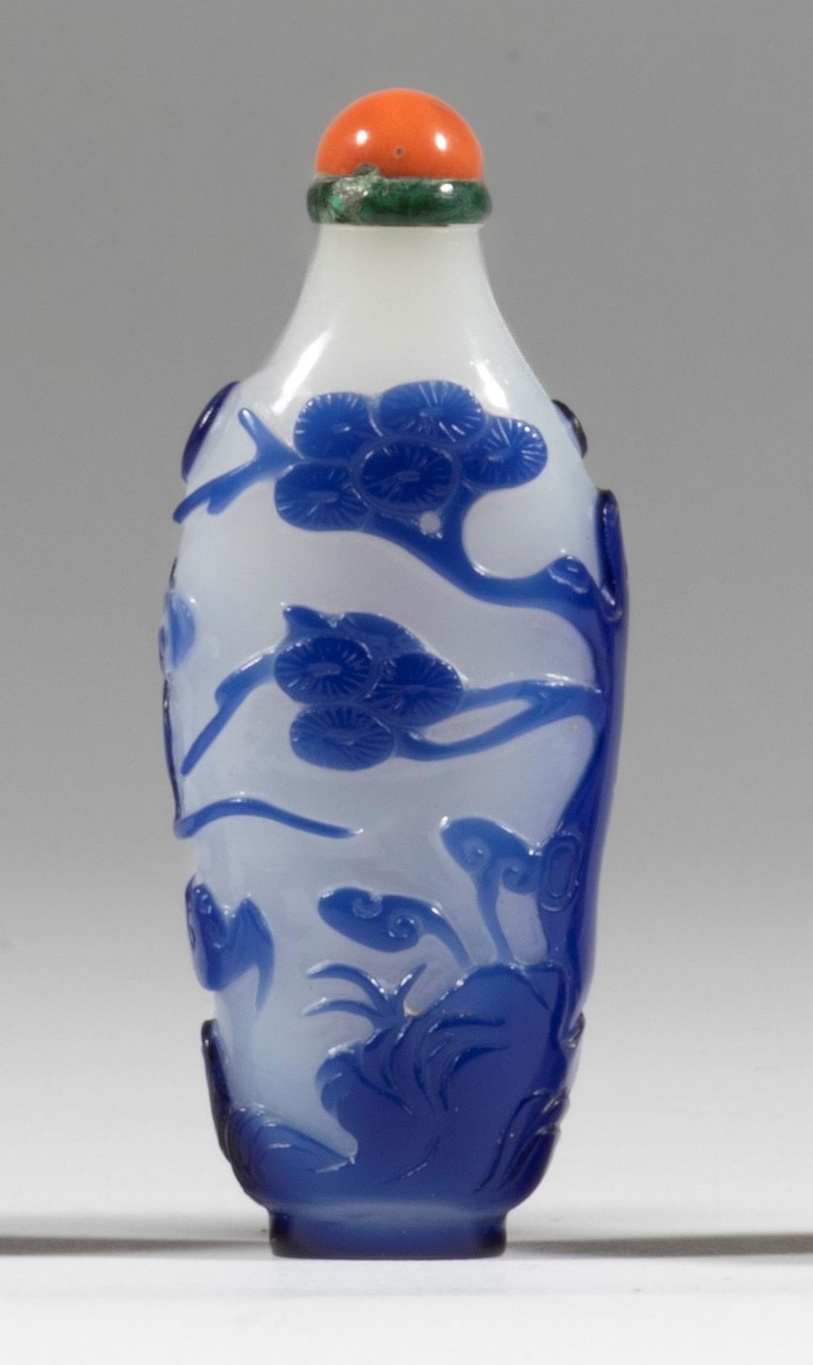 A violet-blue overlay semi-opaque white glass bottle Pine, lingzhi, rockwork, waves, clouds and ...
