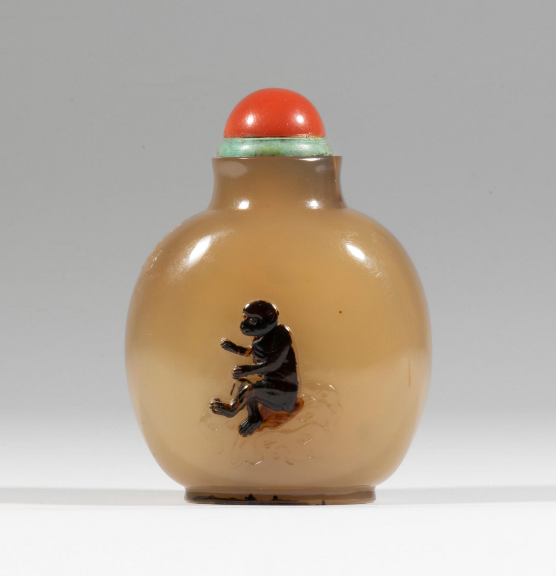 A large Suzhou chalcedony shadow agate snuff bottle 1770-1850 A horse to one side, a monkey to t...