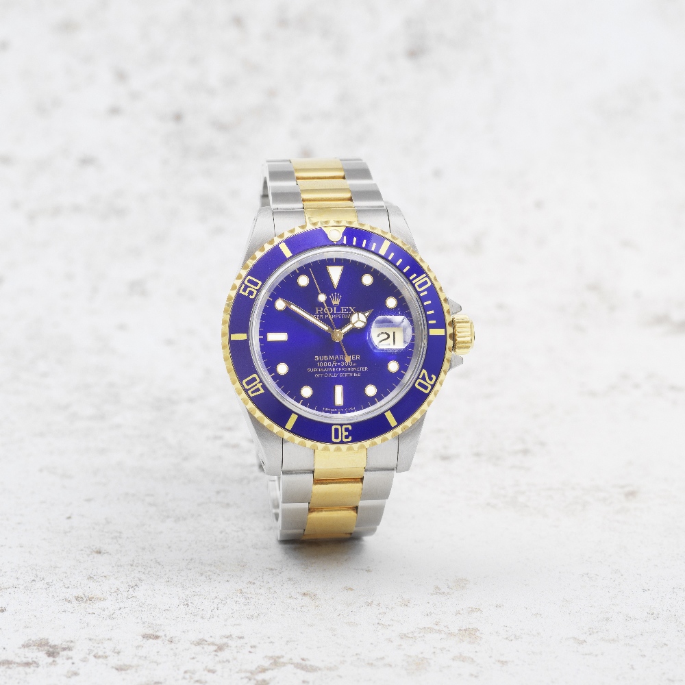 Rolex. A stainless steel and gold automatic calendar bracelet watch Submariner, Ref: 16613, Cir...