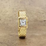 Cartier. An 18K gold manual wind bracelet watch Tank Chinoise, Circa 1940