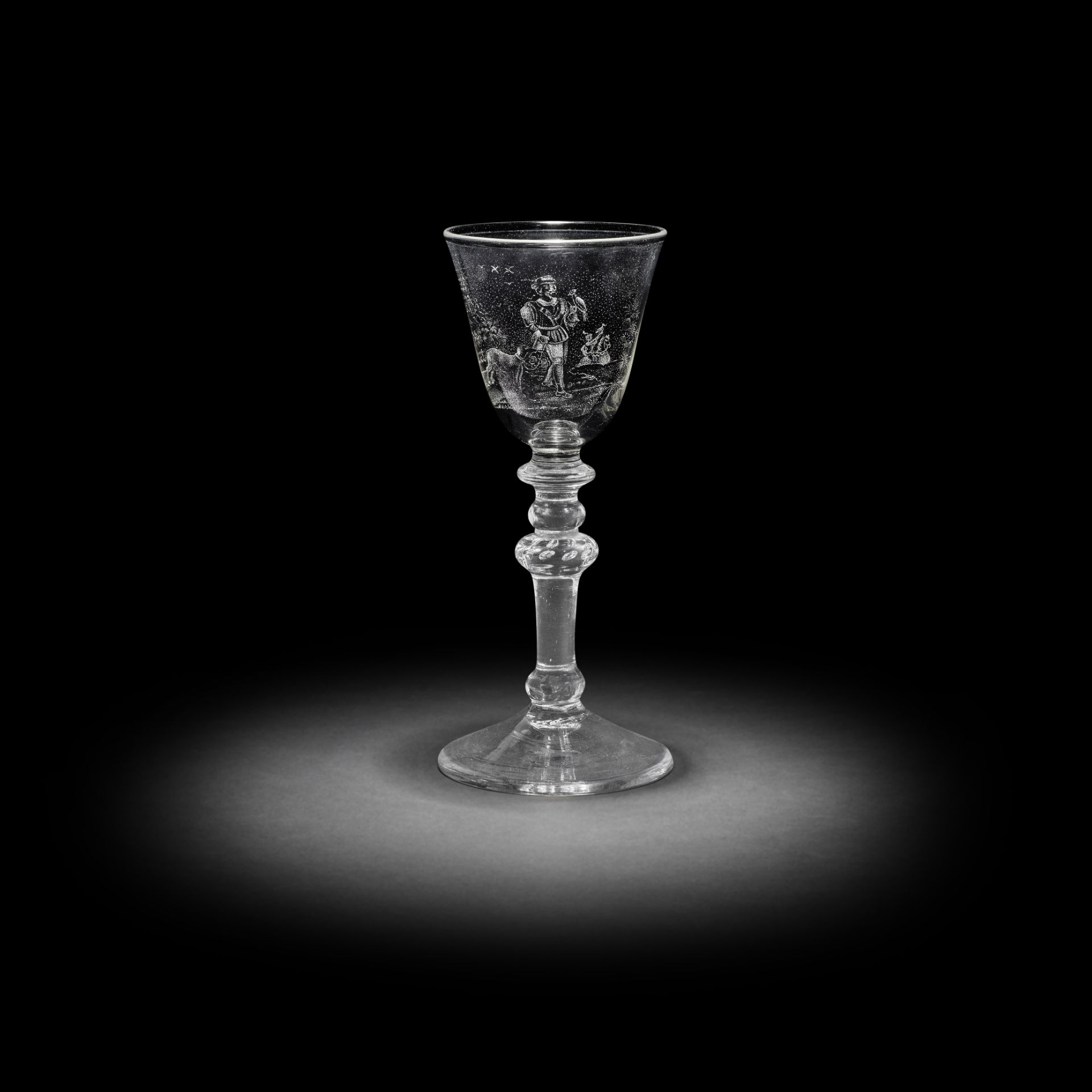 A fine and rare Dutch stipple-engraved light baluster wine glass by J Wolff, circa 1760