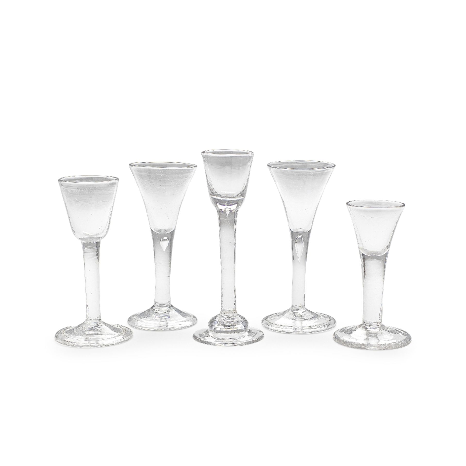 A cordial glass and four plain stem wine glasses, circa 1730-40