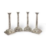 A set of four mid-18th century candlesticks Un-marked, two nozzles with marks for Peter Werritze...