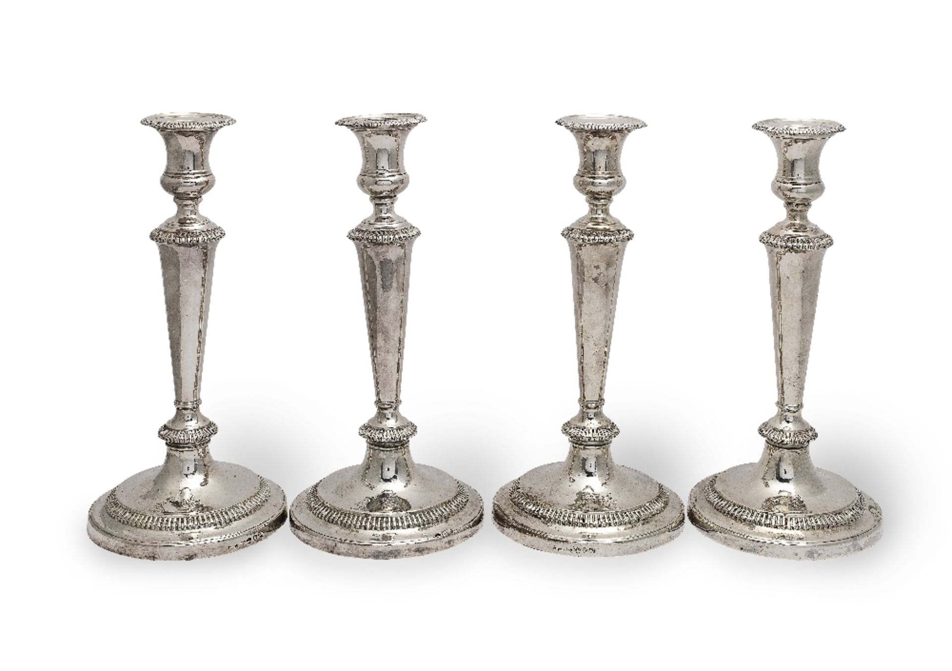 A set of four George III silver candlesticks John Roberts & Co, Sheffield 1814 (4)