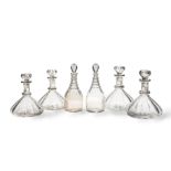 A pair of Regency decanters, together with a set of four cut-glass and gilt highlighted ship's d...