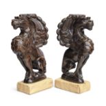 A pair of carved oak gryphons 19th century (2)