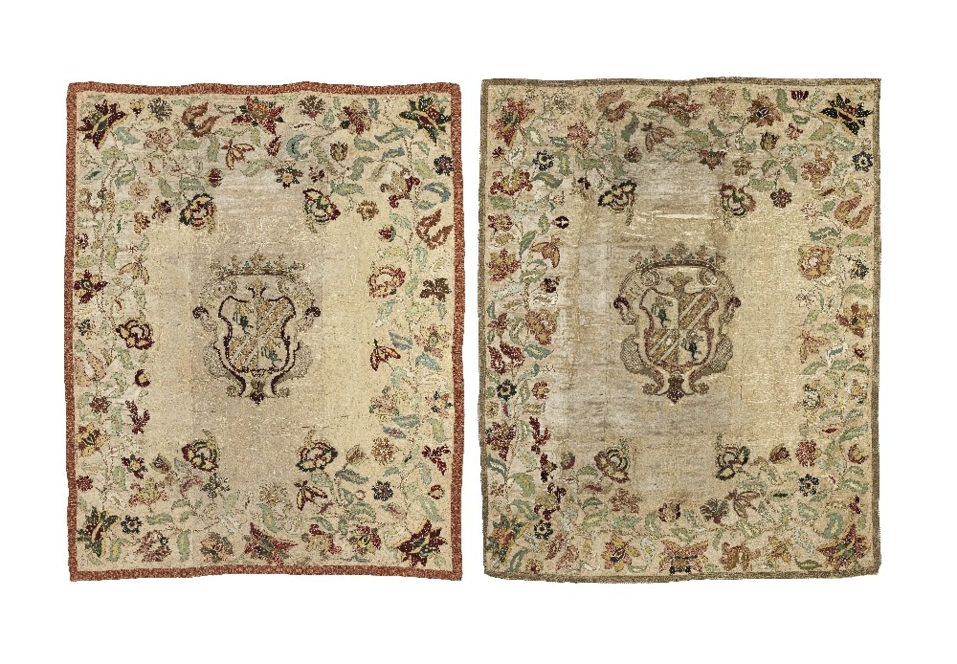 A pair of continental silk embroidered armorial wall hangings 18th century 225cm x 185cm and 228...