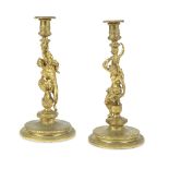 A pair of 19th century French gilt bronze figural candlesticks In the manner of Corneille Van C...
