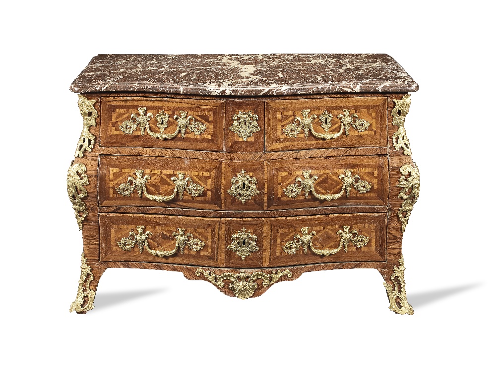 A Regence ormolu mounted kingwood, bois satine and amaranth bombe serpentine commode 1725-1730