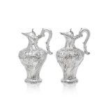 A pair of Portuguese large silver ewers Maker's mark J:S, attributed to Joaquim Dos Santos, Lisb...