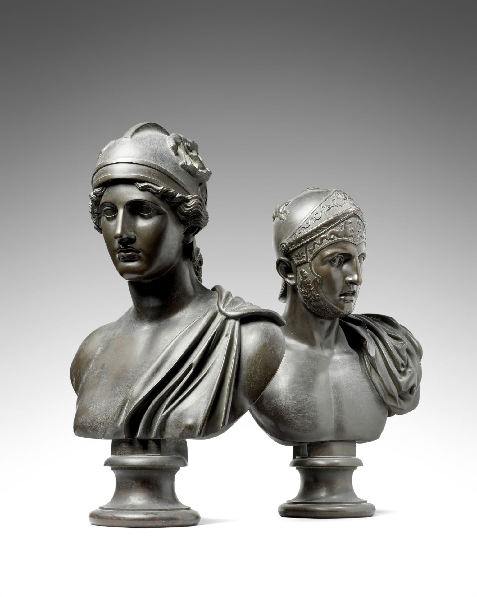A pair of important late 18th/early 19th century Neoclassical bronze busts of Achilles and Roma