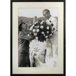 A large format signed photograph of Bernd Rosemeyer's victory presentation for Auto Union at the...