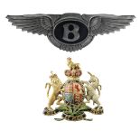 A 'Bentley' garage display emblem and a 'Royal Endorsement Coat of Arms', ((2))