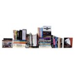 A quantity of books relating to Porsche, Le Mans, Shelby Cobra, and other sports racing and moto...