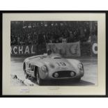 A large format signed photograph of Juan Manuel Fangio in the Mercedes-Benz 300 SLR at Le Mans 1...