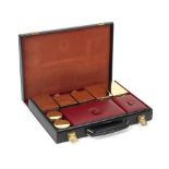 A leather-cased gentleman's vanity set with gold-plated accessories by Hermes of Paris,