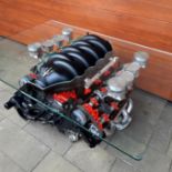 A Maserati Quattroporte 4.2 V8 engine coffee table,