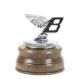 A forward leaning Bentley 'Winged B' mascot, mid-1930s,