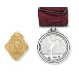 A silver Edinburgh Skating Club medal and a 15ct gold Glasgow Haggis Club medal