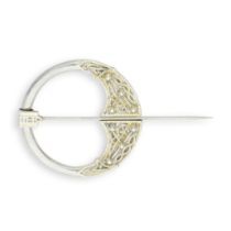 An Irish silver-gilt Celtic Revival penannular brooch