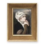 A late 19th century German painted porcelain plaque depicting a young girl at prayer in the Ber...