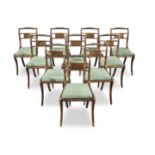 A set of ten Regency simulated rosewood and brass inlaid dining chairs (10)