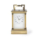 A brass carriage clock with repeat in the 19th century style, the dial and movement signed and ...