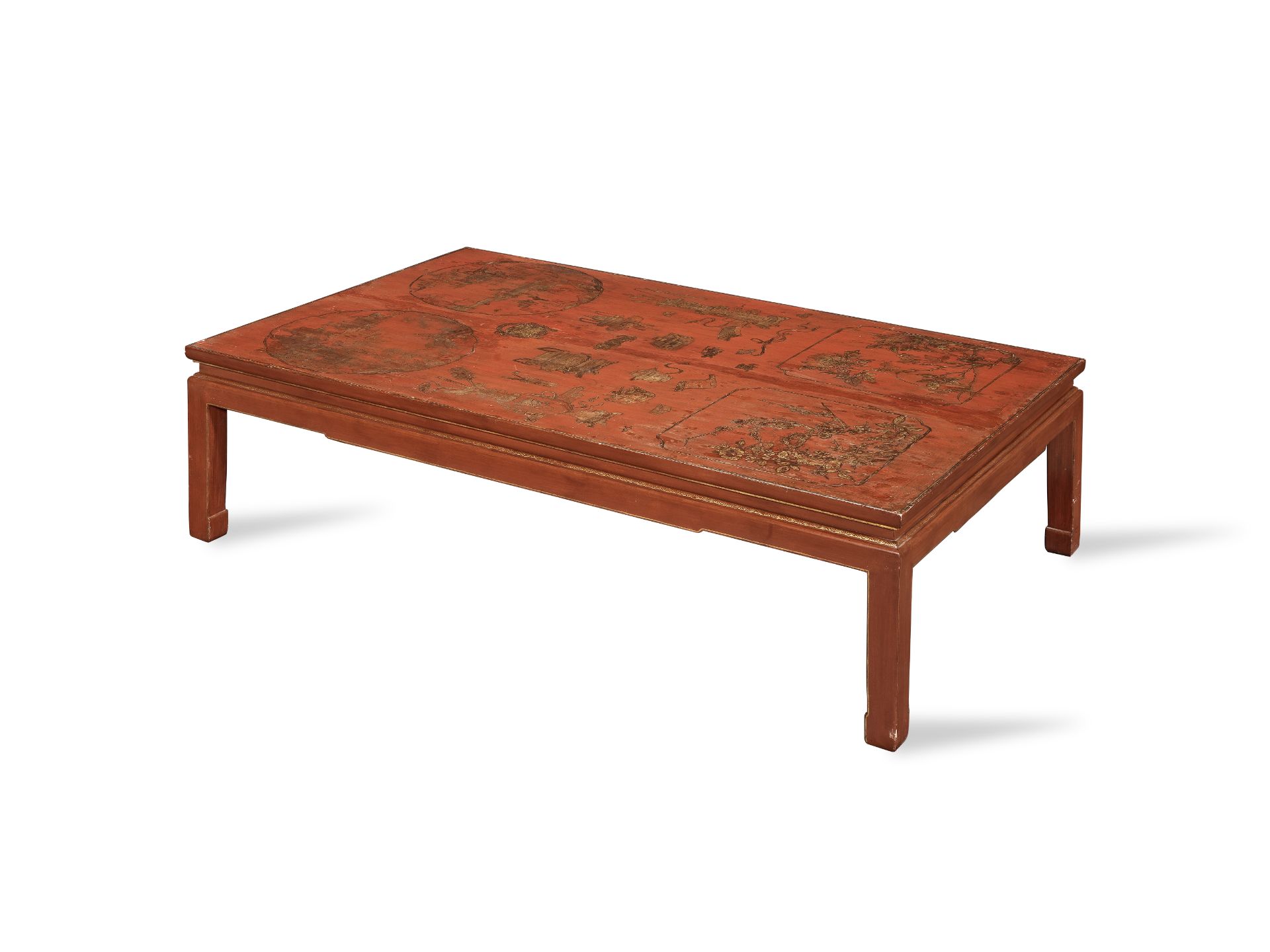 A red lacquer, painted and parcel gilt low/coffee table the lacquer top probably originally form...