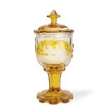 A Bohemian amber stained pedestal goblet and cover circa 1850-70, probably by Karl Pfohl