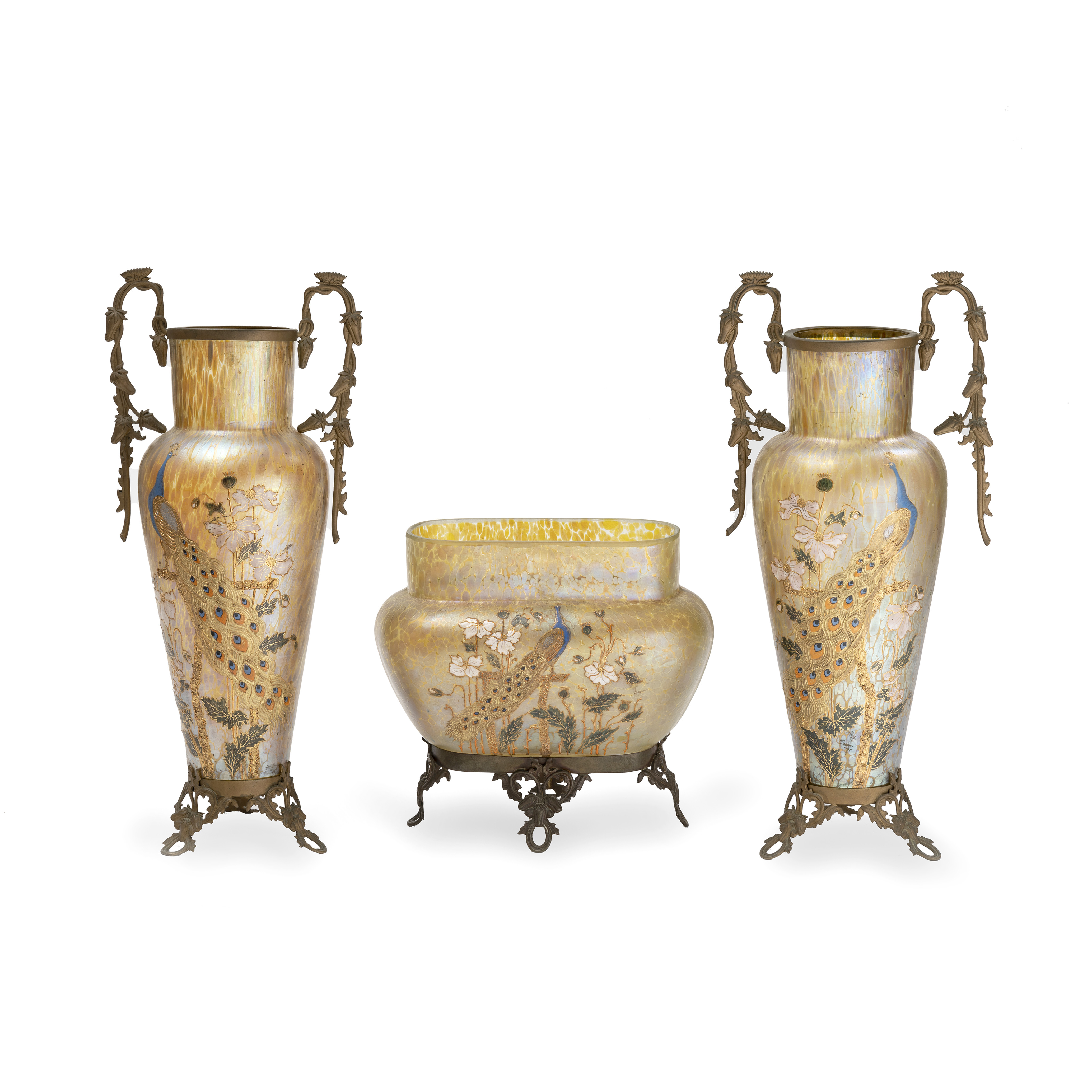 A garniture of three early 20th century French gilt metal mounted iridescent amber spotted glass...