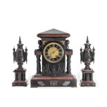 A late 19th century French patinated bronze and black and rouge clock garniture in the Egyptian ...