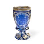 A Bohemian blue flashed and gilt heightened glass Armorial goblet circa 1850-70