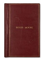 A Morocco leather bound script binder inscribed to the front 'Roger Moore' in gilt