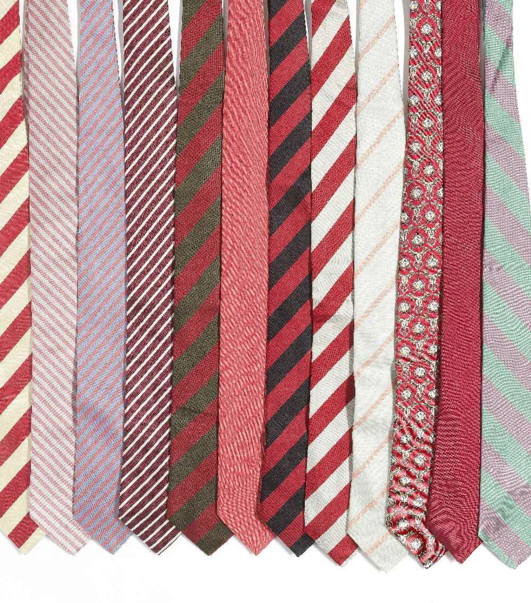 A selection of twelve silk ties belonging to Sir Roger Moore