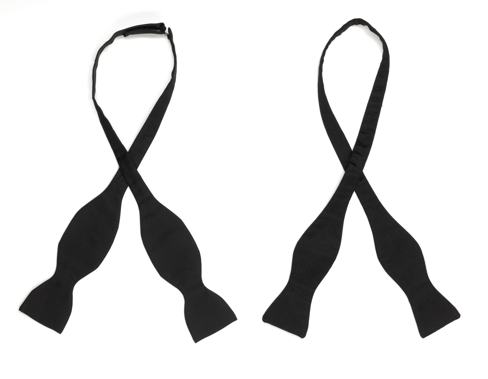 Two black silk bow ties belonging to Sir Roger Moore