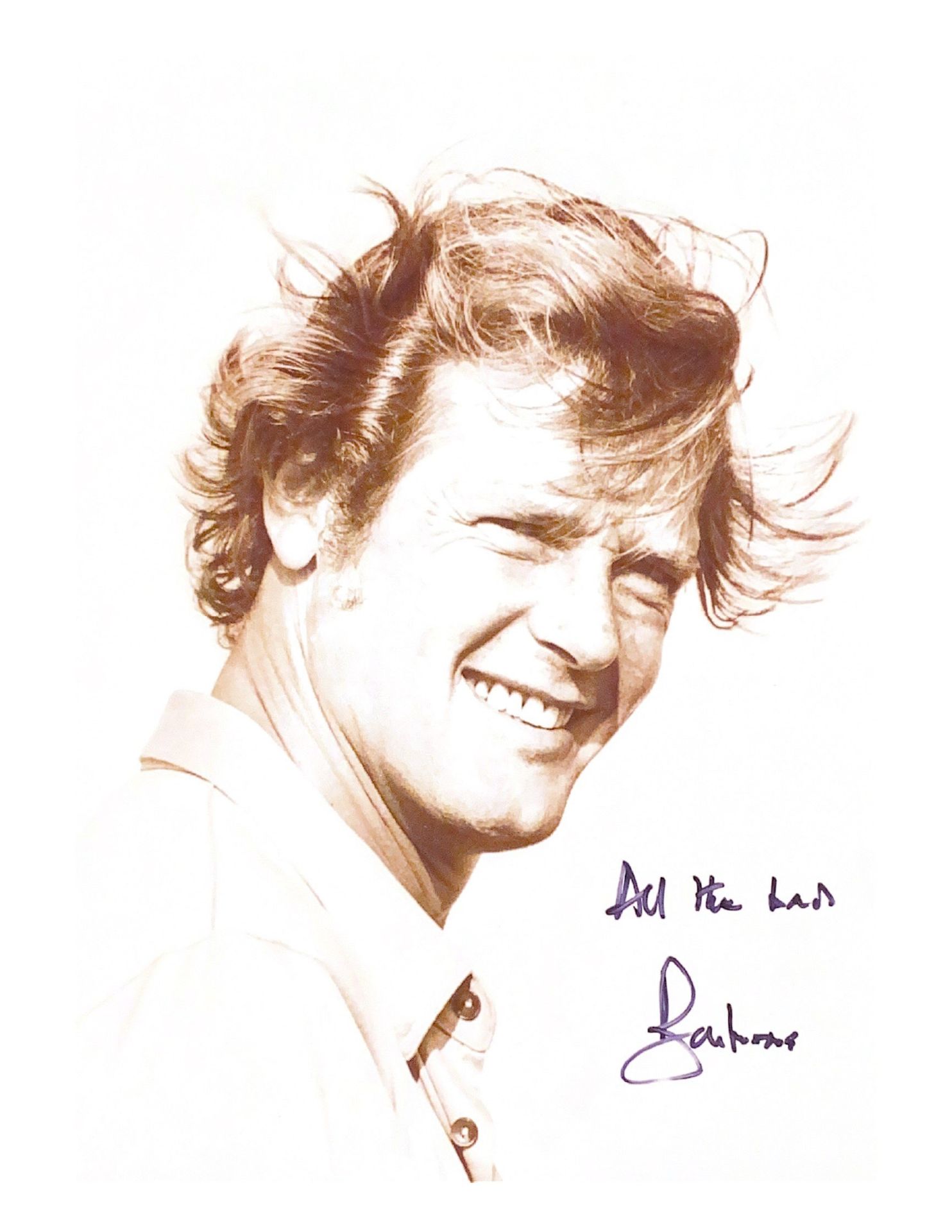 A sepia signed photographic print of Sir Roger Moore