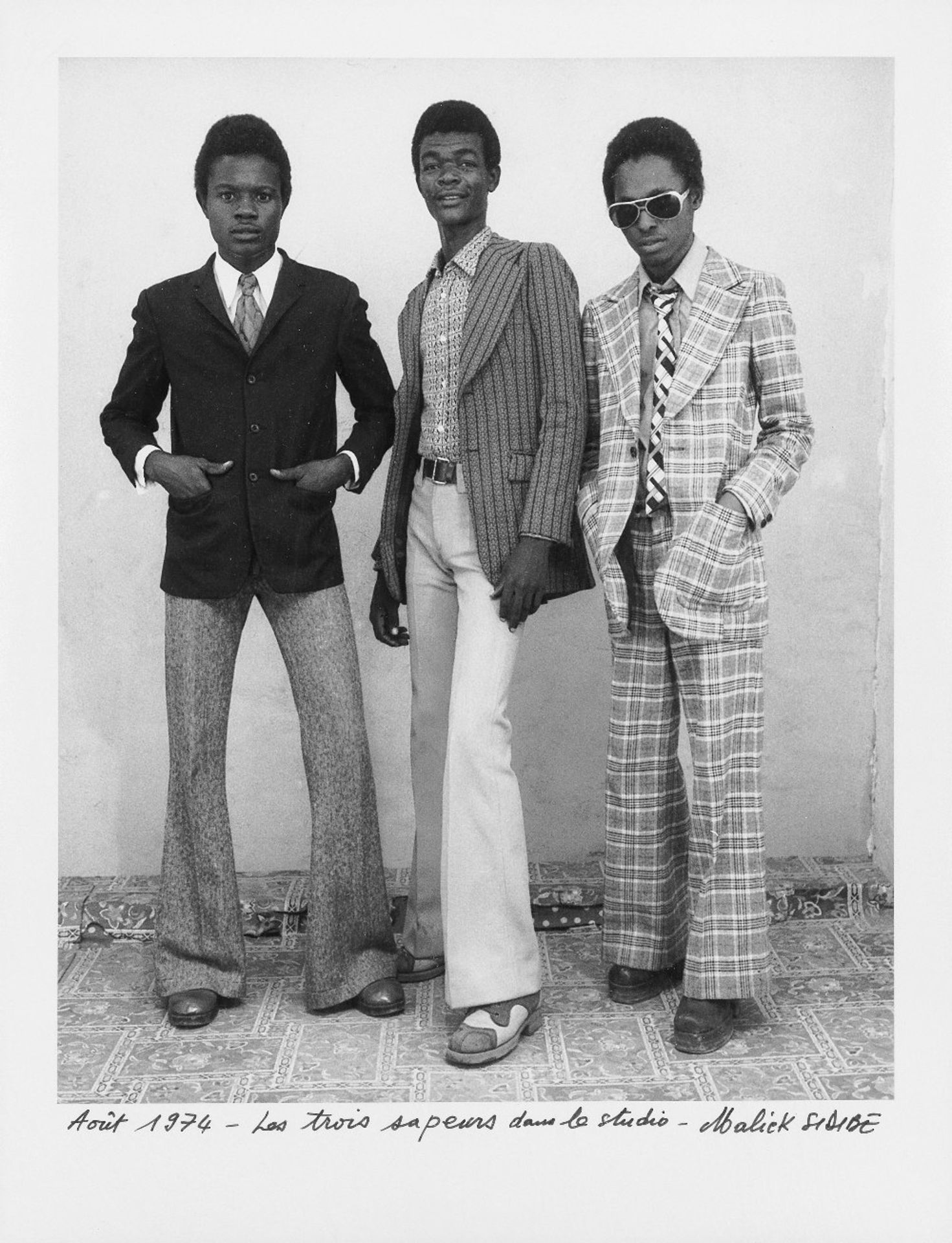 Malick Sidib&#233; (Malian, 1935-2016) The three Sapeurs in the studio (framed)