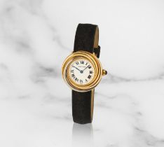 Cartier. A lady's three colour 18K gold quartz wristwatch Cartier. Montre bracelet de dame en tr...