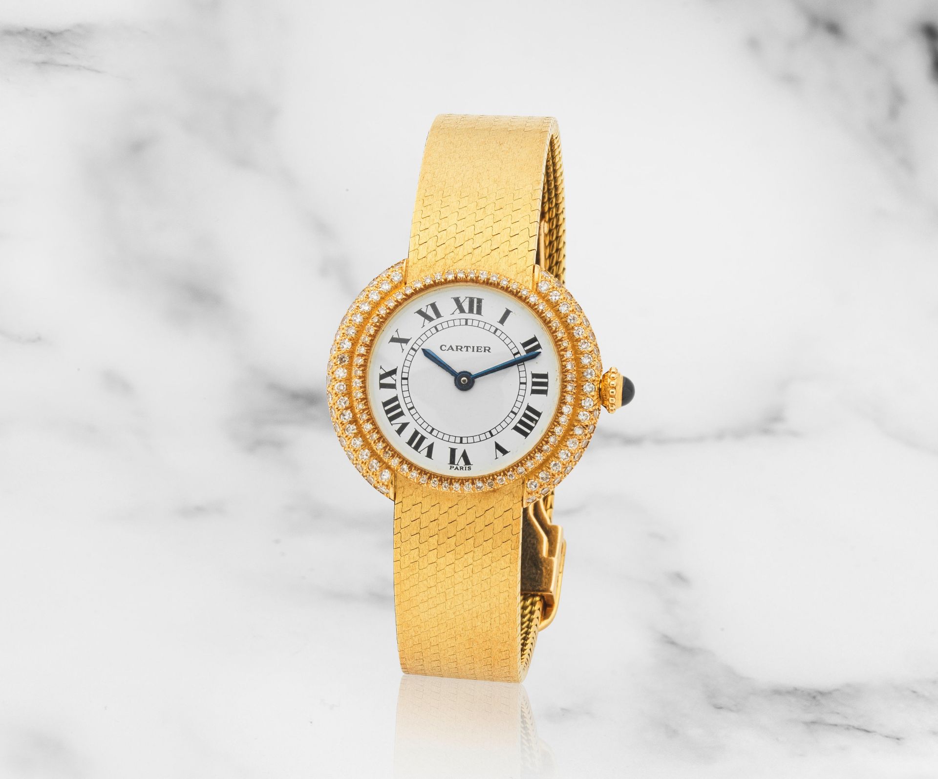 Cartier. A lady's 18K gold and diamond set manual wind bracelet watch Cartier. Montre bracelet d...