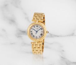 Cartier. A lady's 18K gold quartz calendar bracelet watch Cartier. Montre bracelet de dame en or...