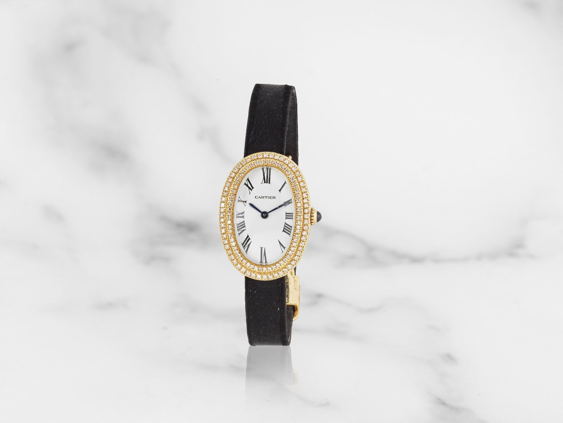 Cartier. A lady's 18K gold and diamond set manual wind wristwatch Cartier. Montre de dame en or ...